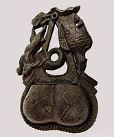 Front view of the vintage cast metal matchholder wall pocket showing hunting theme design with rabbit and bird, two pocket sections