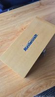 Closed wooden case with Mastercraft logo on top, natural finish.