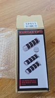 Original Kuryakyn box showing product image and branding details for ISO grips with heated grips feature.