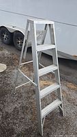Side view of 5-foot aluminum step ladder showing five steps and A-frame structure.