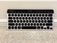 Top-down view of Logitech Bluetooth Easy-Switch K811 keyboard showing layout and key labels, including Mac-specific keys and function keys.