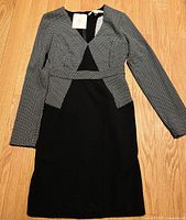 Front view of Diane Von Furstenberg black and white long sleeve dress showing pattern and v-neck detail