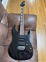 Full front view of the guitar showing body shape and finish