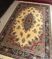 Overview of rug laid flat on floor showing full design