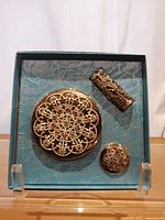 Set of 3 vintage Hampden cosmetic items in original box, showing gold filigree with colored stones.