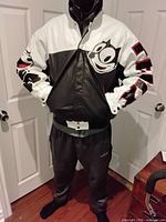 Front view showing the black and white leather jacket with Felix the Cat's face on the chest and 'FELIX' on the sleeve.