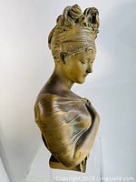 Front view of the full bust on a clear stand