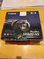 Closed Canon box showing model SX620 HS branding and Wi-Fi/NFC logos