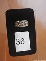 Front view of the sterling silver ring on black velvet display showing diamond-shaped marcasite stone pattern.