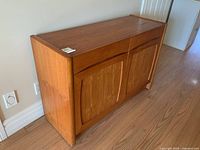 Front view showing two drawers above two cupboard doors