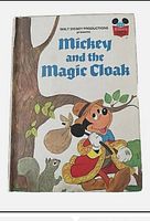 Cover of Mickey and the Magic Cloak showing vintage Disney illustration and title