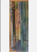 Spine view showing titles and Walt Disney branding on 7 storybooks.