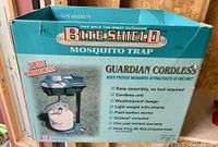 Box of Bite Shield Guardian Cordless mosquito trap with features listed and price sticker visible.