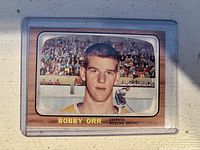 Front view of Bobby Orr hockey card with player portrait and name.