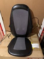 Front view of black and grey Homedics massage and heat seat and back cushion.