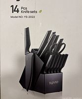 Photo of the factory sealed Syvio 14-piece kitchen knife set with a black knife block showing all knives and shears in their slots.