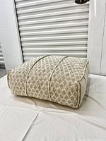 Side view of floor cushion showing patterned fabric and shape.