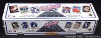 Image of factory sealed 1991 Upper Deck baseball card complete set in rectangular box with shrink wrap intact, displayed horizontally showing product branding and card images on packaging.