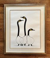 Full view of professionally framed lithograph showing the complete artwork of three stylized birds titled 'Friends'. Wood frame with gold trim and double matting visible.