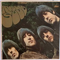 Front cover of The Beatles Rubber Soul LP showing four band members' faces with handwritten pen markings.