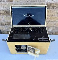 Open view of Cardi-all portable heart machine showing controls and internal components.