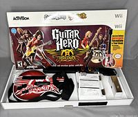 Wireless Aerosmith branded guitar controller in original Guitar Hero Aerosmith Wii box, showing front design and packaging.