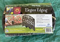 Box of new Wrought Iron Style Elegant Edging lawn border showing features and branding