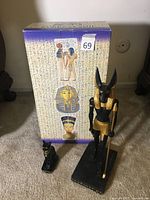 Large Anubis statue and small Bastet cat statue with original Egyptian Collection box in background