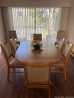 Full view of teak dining table with chairs