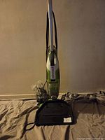 Front view of assembled Bissell CrossWave with visible brand logo and additional cleaning head attachment in front.