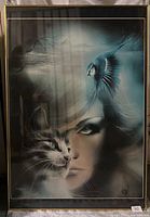 Full view of framed fantasy art print showing a woman's face, a cat, and a bird with misty ethereal background and artist signature.