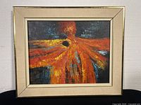 Framed abstract oil painting by Brassó with warm colors and cream frame