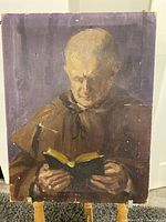 Full view of the oil painting showing a monk reading a book, with a purple background.