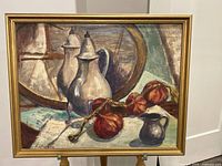 Full view of the framed oil painting showing metal pitchers, dried onions, and a round tray in the background.