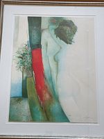 Close-up showing the lithograph artwork with artist signature and numbering 141/180.