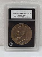 Obverse side of 1976-P Eisenhower Bicentennial dollar coin showing Eisenhower's profile and inscriptions in plastic certification holder.