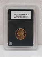 Front view of 1987-S Jefferson Nickel encapsulated with certification label showing coin and grading details.