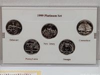 Front side of platinum state quarters showing Delaware, New Jersey, Pennsylvania, Georgia, and Connecticut designs in protective case.