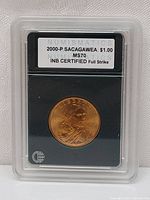 Front view of 2000-P Sacagawea $1 coin in INB graded case showing label and coin obverse.