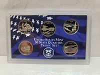 Front of the set showing reverse side designs of the 5 state quarters with US flag background