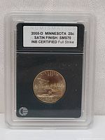 Front and back of graded 2005-D Minnesota State Quarter in protective case with certification label.