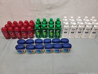 Full lot showing three product lines: Suave shampoo, Irish Spring body wash, Dove lotion, and rows of Vaseline jars in front.