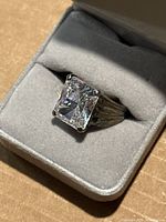 Front view of ring in grey jewelry box