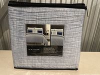 Full view of the packaged duvet set showing the brand and pattern.