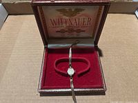 Vintage Wittnauer women's wristwatch inside original presentation box with red velvet interior.