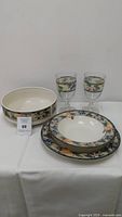 Mikasa Garden Harvest collection dinnerware plates, bowl, and two glasses showing pattern and quantity.