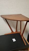 Front view of the triangular corner table