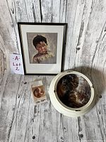 Framed print of crying boy, signed by Dorothy Oxborough, metal-style framed plate with papers and original plastic cover