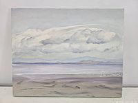 Front view of the acrylic painting showing coastal scene with cloudy sky, sea, and shore.