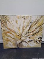 Full view of large abstract acrylic painting on canvas with gold, white, and brown hues.